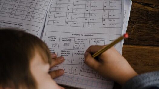 toddler writing indoors